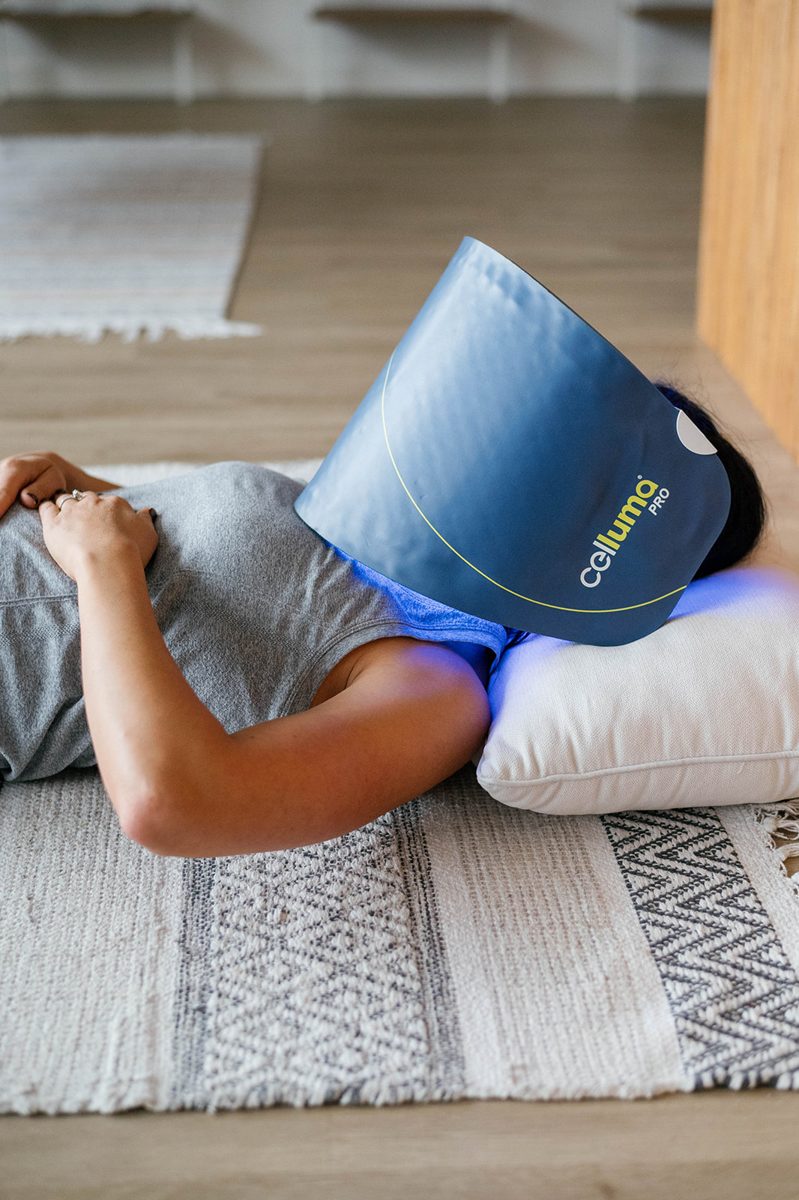 A guest relaxes during an LED light treatment