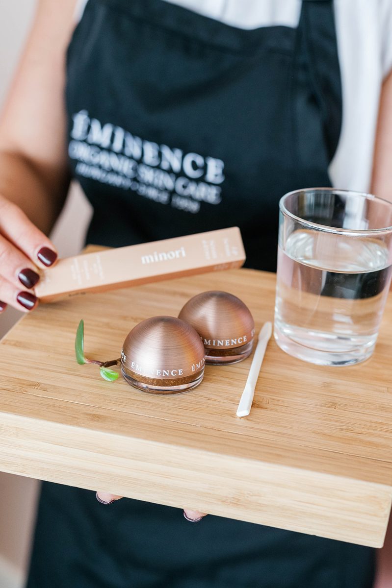 An esthetician presents an Éminence treatment tray