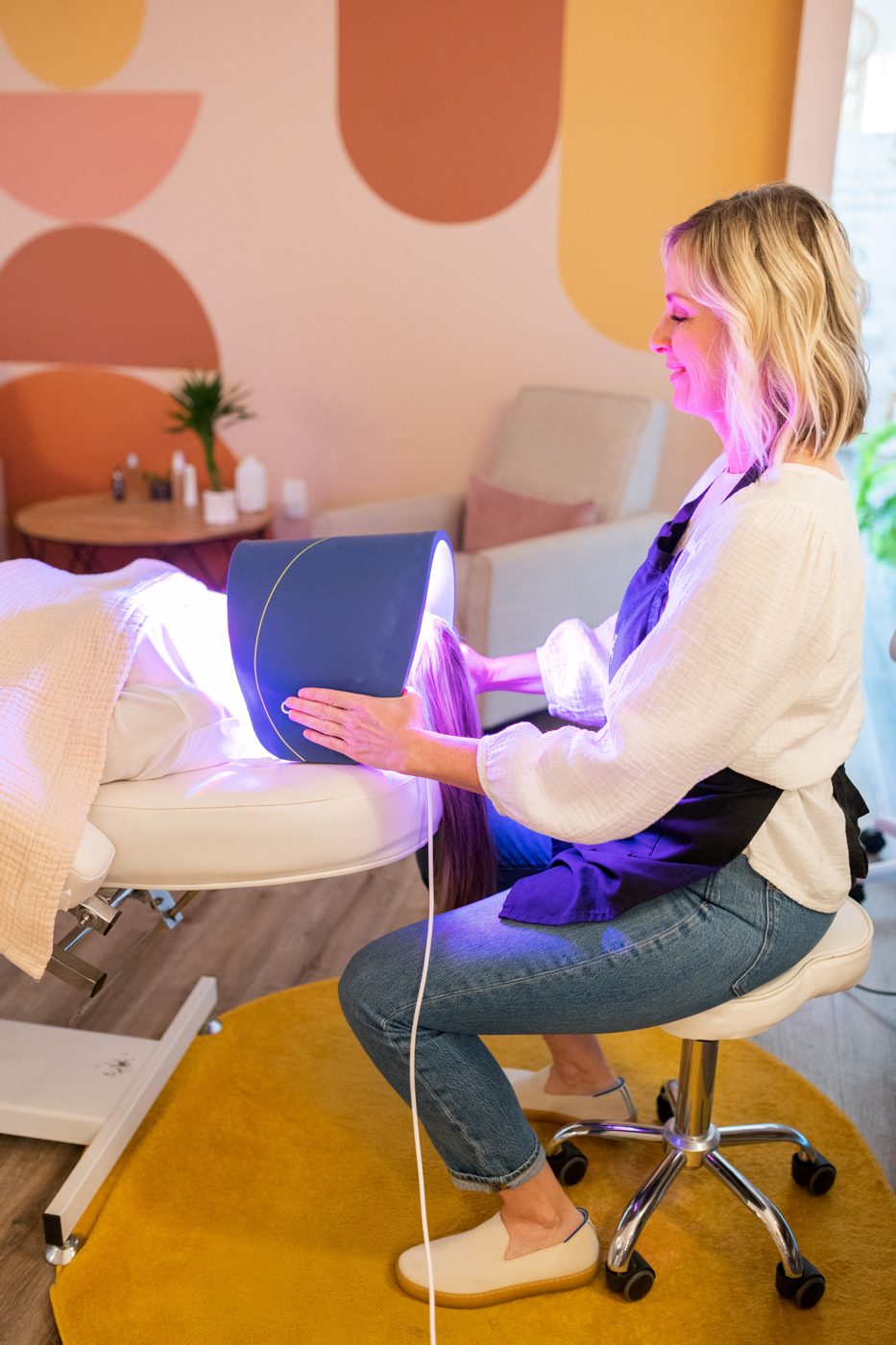 An LED light therapy panel treatment in the Mia June studio