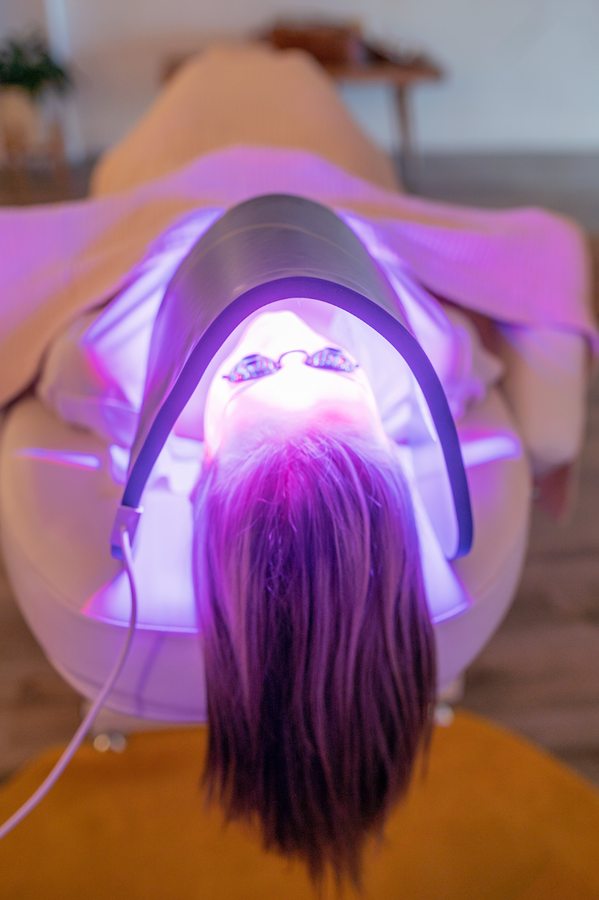 A guest relaxes during a luxury LED treatment at Mia June